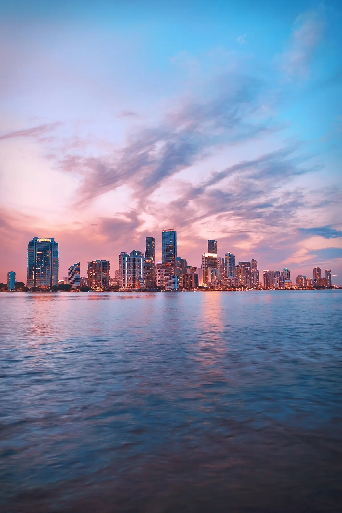 Miami skyline reflected on Biscayne Bay at dusk